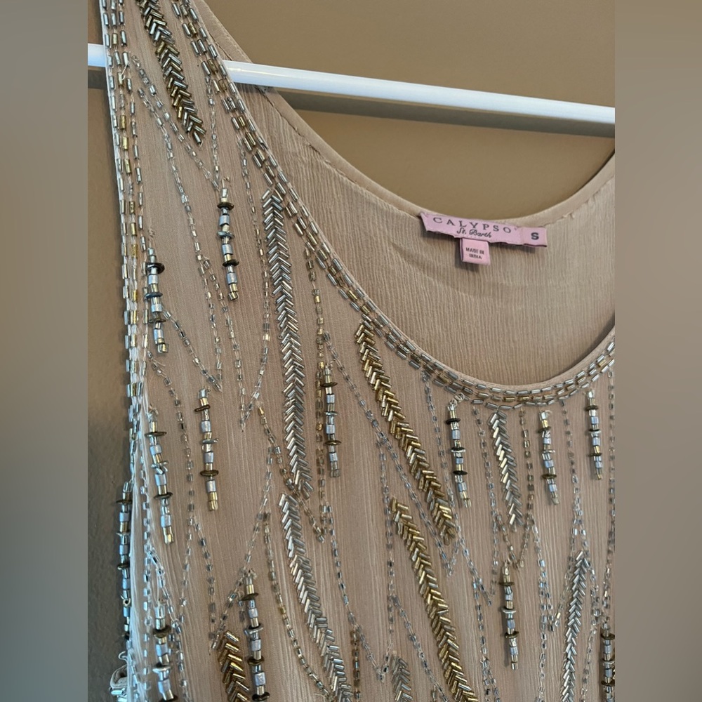 Heavily beaded silk lined, gold top with asymmetrical bottom